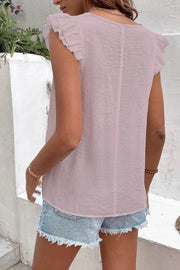 Dusty pink embroidered trim flutter sleeve blouse with textured fabric.