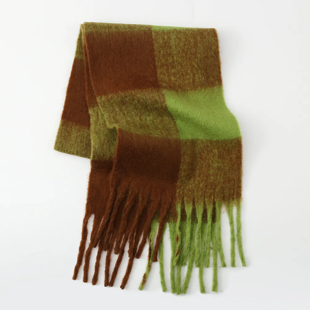 Checked plaid fluffy scarf in olive brown and green with fringe detail.