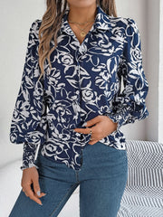 Navy floral print blouse with shirred cuffs and button front