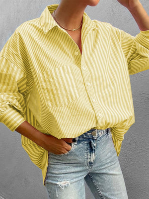 Oversized light yellow striped button-down shirt with a chest pocket and relaxed fit.
