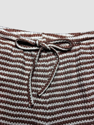 Maternity wide leg pants in dark brown and white stripe with drawstring waist.