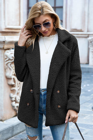 Black teddy pea coat with double-breasted closure and notched lapels.