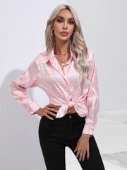 Blush pink satin leopard print button-down shirt with a knotted hem.