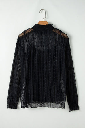 Black sheer mock neck blouse with textured dots and vertical pleats.