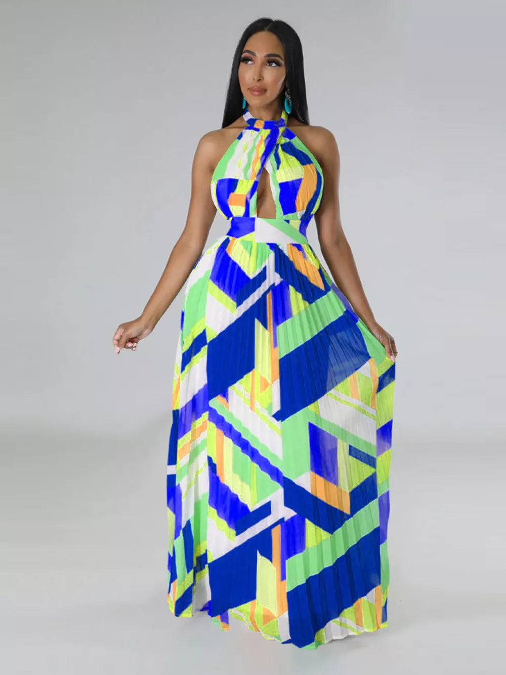 Halter neck maxi dress with bold geometric print, defined waistband, and pleated skirt.