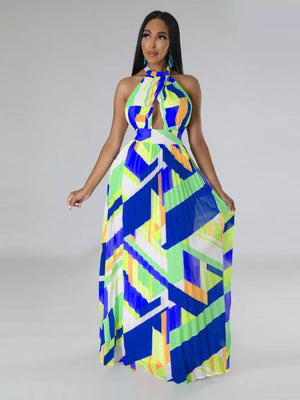 Halter neck maxi dress with bold geometric print, defined waistband, and pleated skirt.