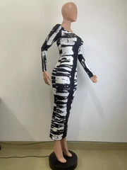 Black and white tie-dye maxi dress with long sleeves and a scoop neckline.