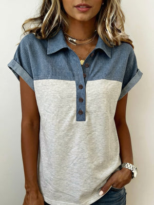 Two-tone denim polo shirt with button-down collar and short sleeves.