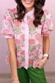 Blush pink floral puff sleeve maternity blouse with ruffled placket and button front.
