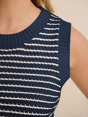 Navy blue knit sweater vest with white and brown horizontal stripes and textured details.