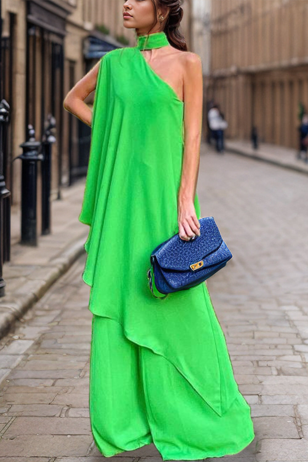 Green asymmetric drape wide-leg set with choker neckline and flowing silhouette.