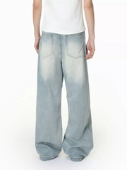 Men's light wash wide-leg jeans with vintage distressing and classic back pockets.