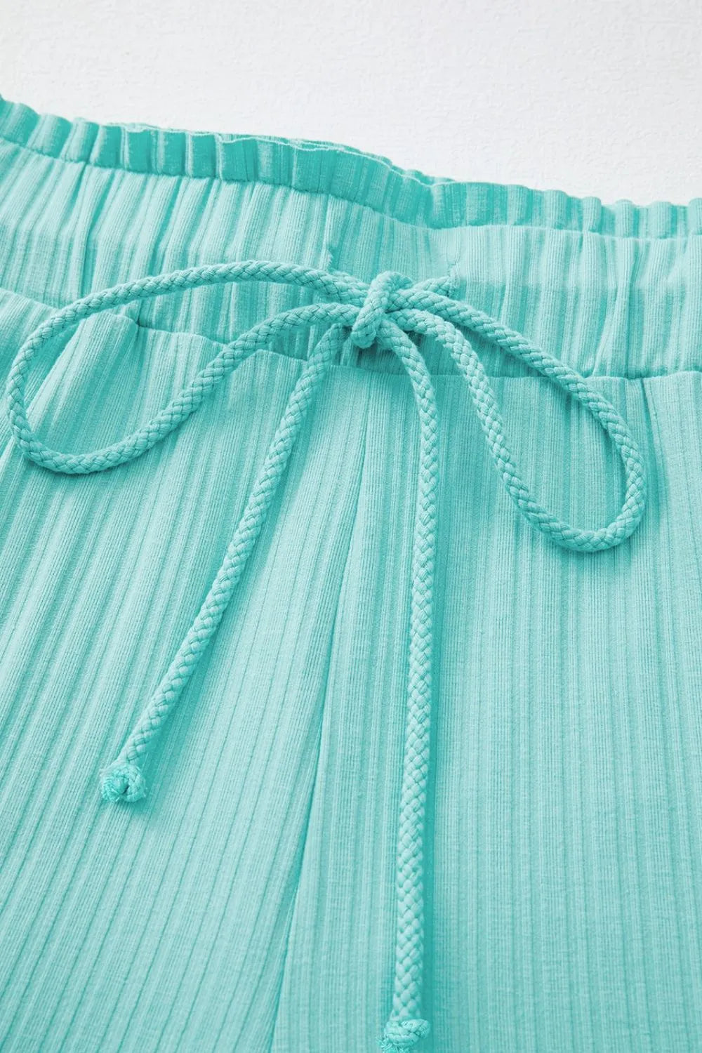 Ribbed Tiffany Blue drawstring shorts with elastic waistband detail.