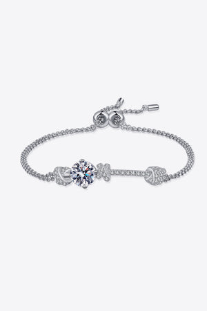 Silver sterling bracelet with a central round crystal and pave charm details.