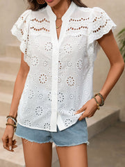 White eyelet embroidered button-up maternity overshirt with flutter sleeves and a V-neck.
