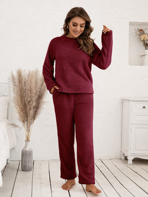 Plush burgundy loungewear set with raglan sleeves and relaxed fit pants.