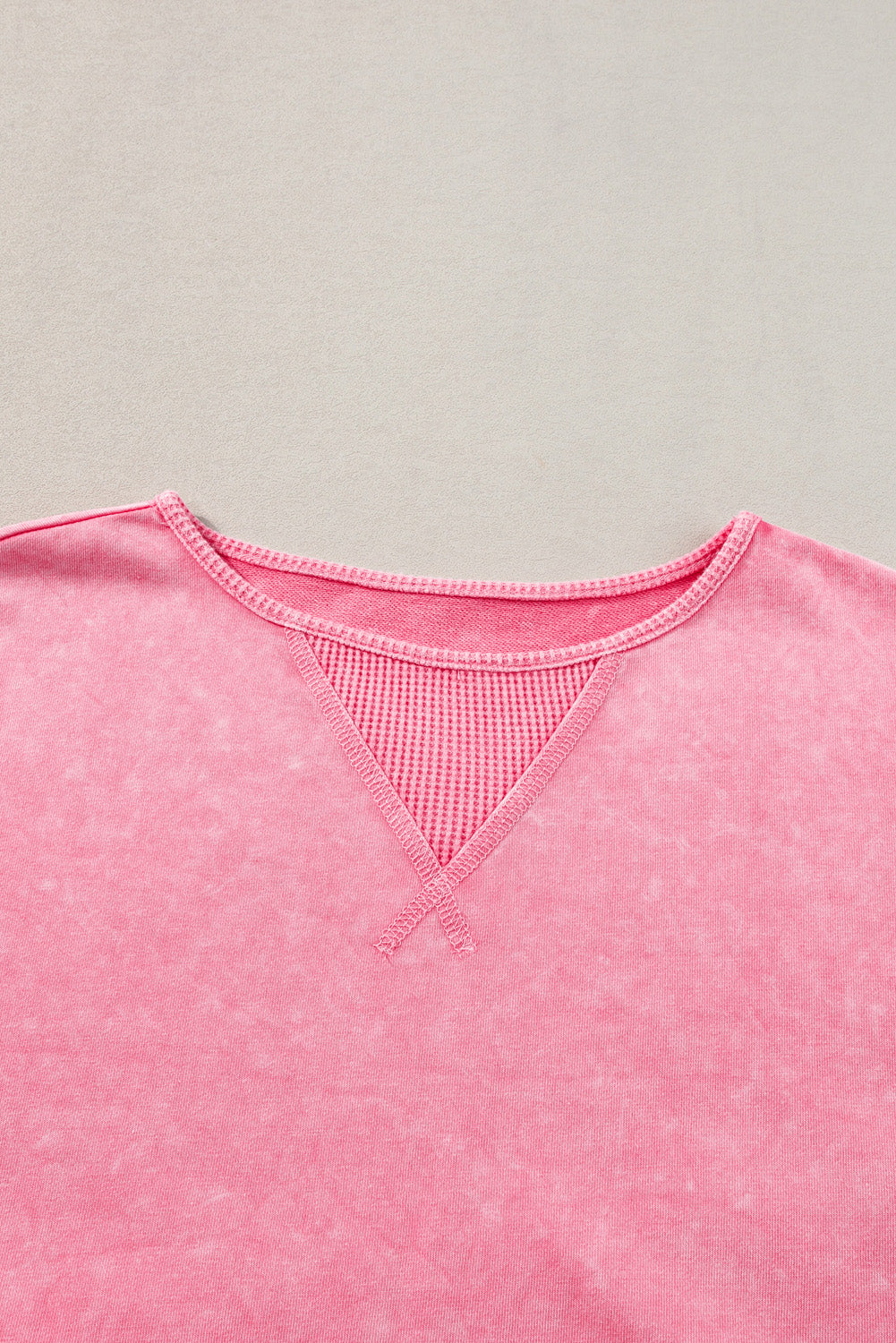 Pink acid wash tee with waffle knit inset at crew neck and contrast stitching