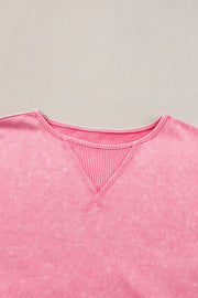 Pink acid wash tee with waffle knit inset at crew neck and contrast stitching