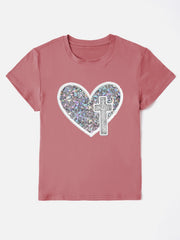 Dusty pink t-shirt with iridescent heart and cross appliqué detail.