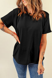 Black rolled sleeve raglan tee with a relaxed fit, styled with jeans.