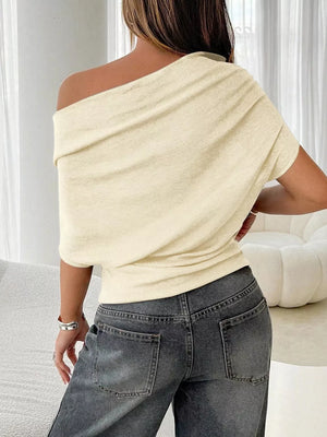 Apricot ruched off-shoulder knit t-shirt with draped neckline.
