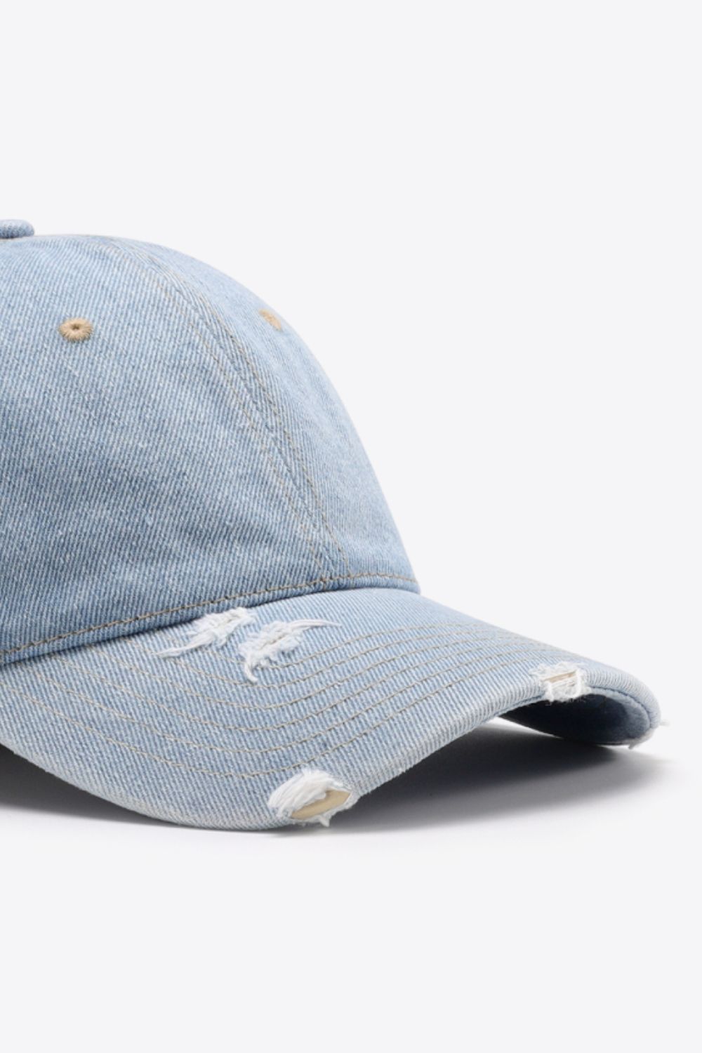 Light blue distressed denim baseball cap with frayed details