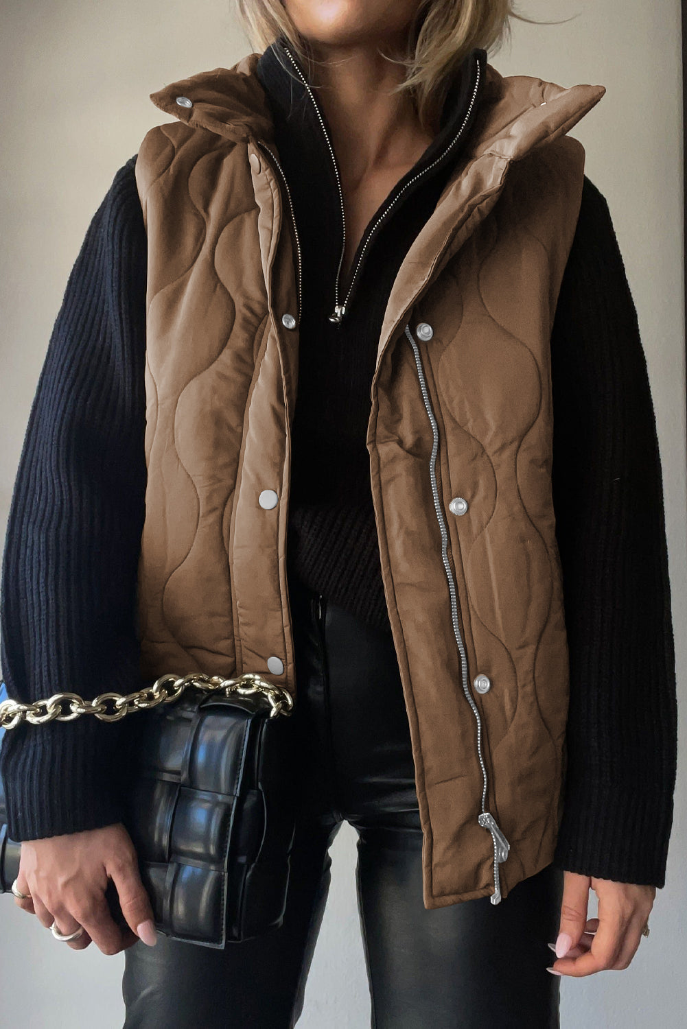 Quilted stand-collar utility gilet in taupe with diamond quilting, zip and snap front, and silver hardware.