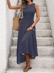 Dark blue polka dot maxi dress with a flattering silhouette, sleeveless, round neck, and flowing skirt.