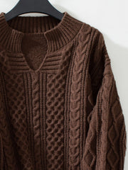 Chocolate cable knit sweater with keyhole neckline and ribbed cuffs.