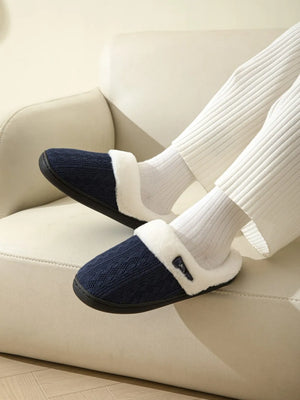 Dark Navy cable knit shearling house slippers with a decorative button detail.