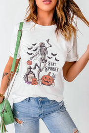 White graphic t-shirt with skeleton, pumpkins, bats and Stay Spooky text