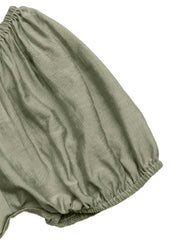 Sage green smocked waist maxi dress detail with textured fabric and elasticated hem.