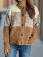 Colorblock crewneck button-down acrylic cardigan in beige, caramel, and gray stripes.