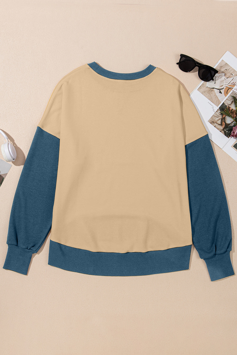 Chic Contrast Crewneck Sweatshirt in tan with blue sleeves and trim.