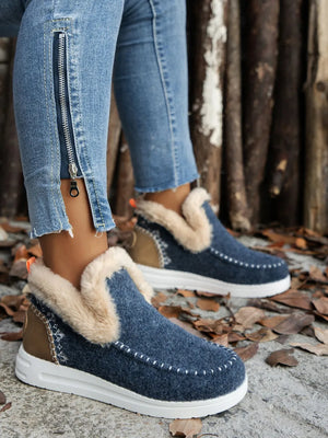 Felted slippers in navy with faux shearling trim and stitch detail.