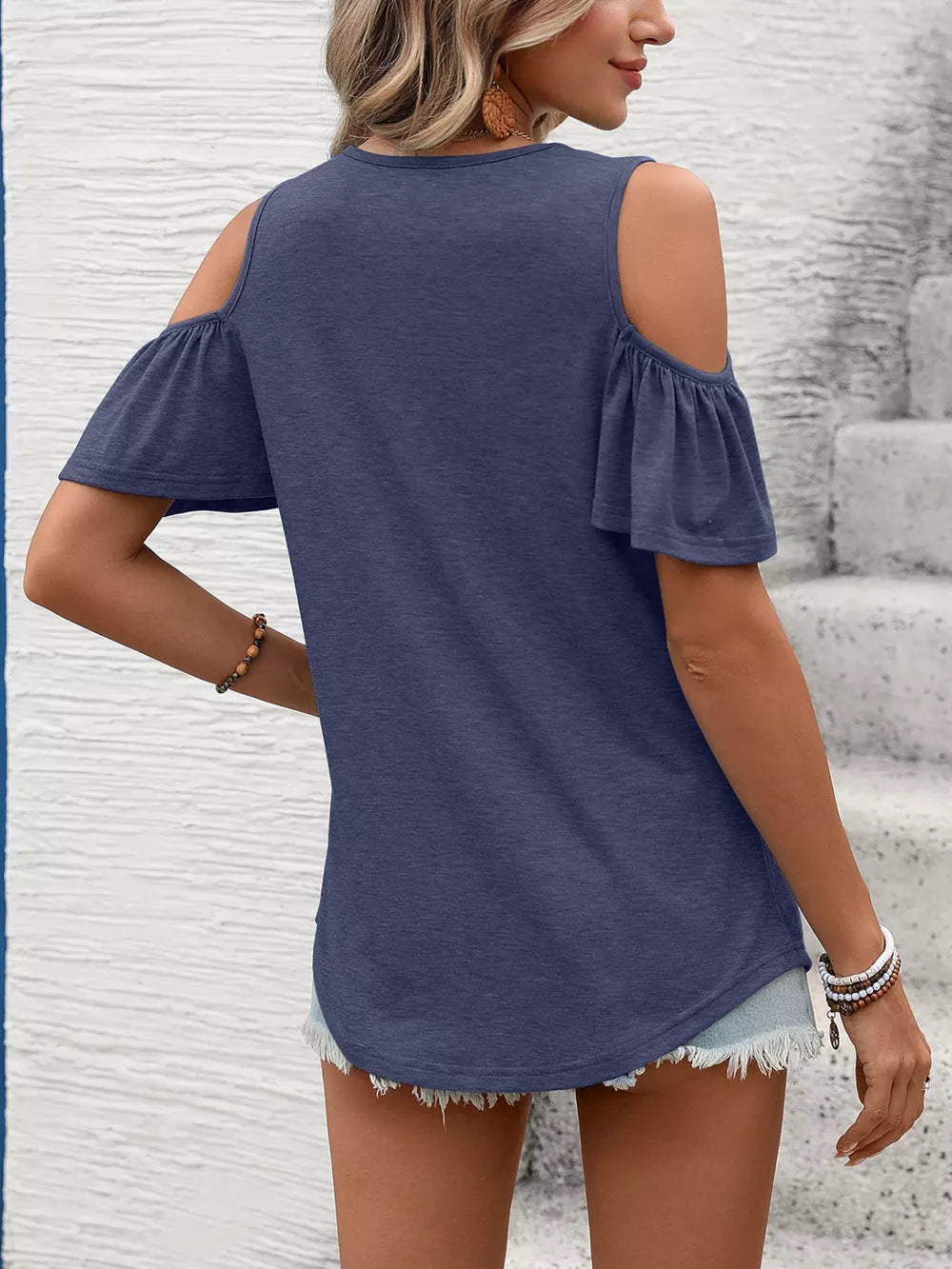 Navy blue ruched cold shoulder t-shirt with ruffled short sleeves.