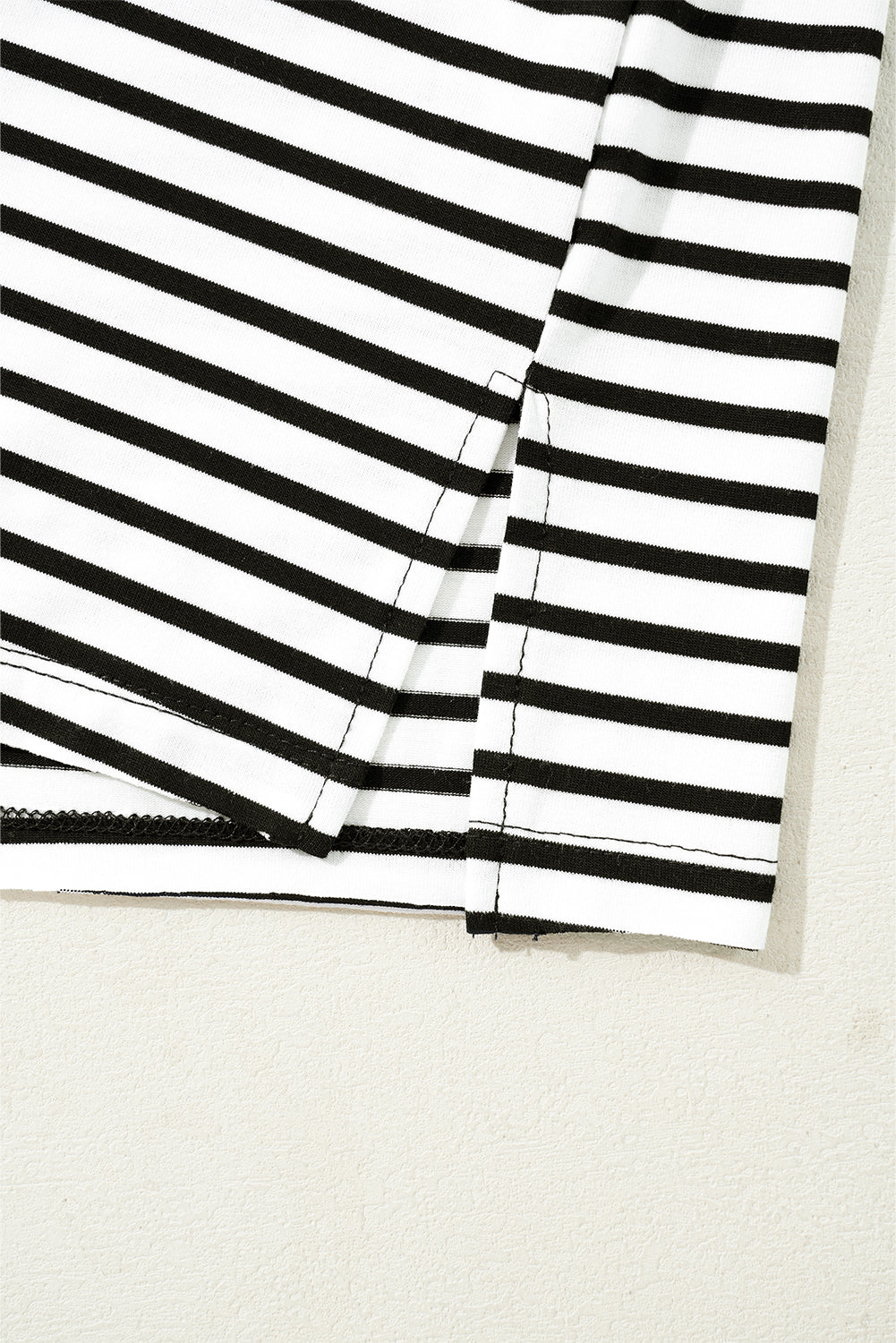 Black and white striped t-shirt with side slit detail