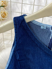Dark blue cotton denim vest with asymmetrical neckline and zipper detail.