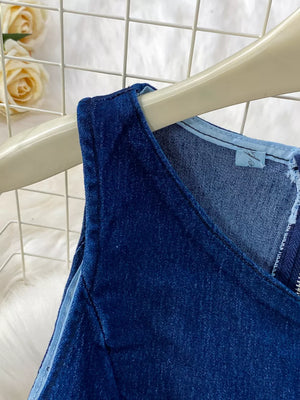 Dark blue cotton denim vest with asymmetrical neckline and zipper detail.