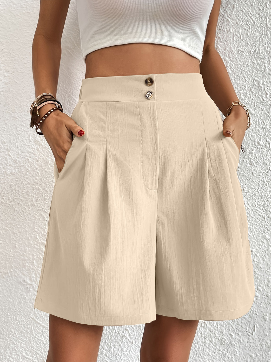 Beige pleated front bermuda shorts with button closure and pockets