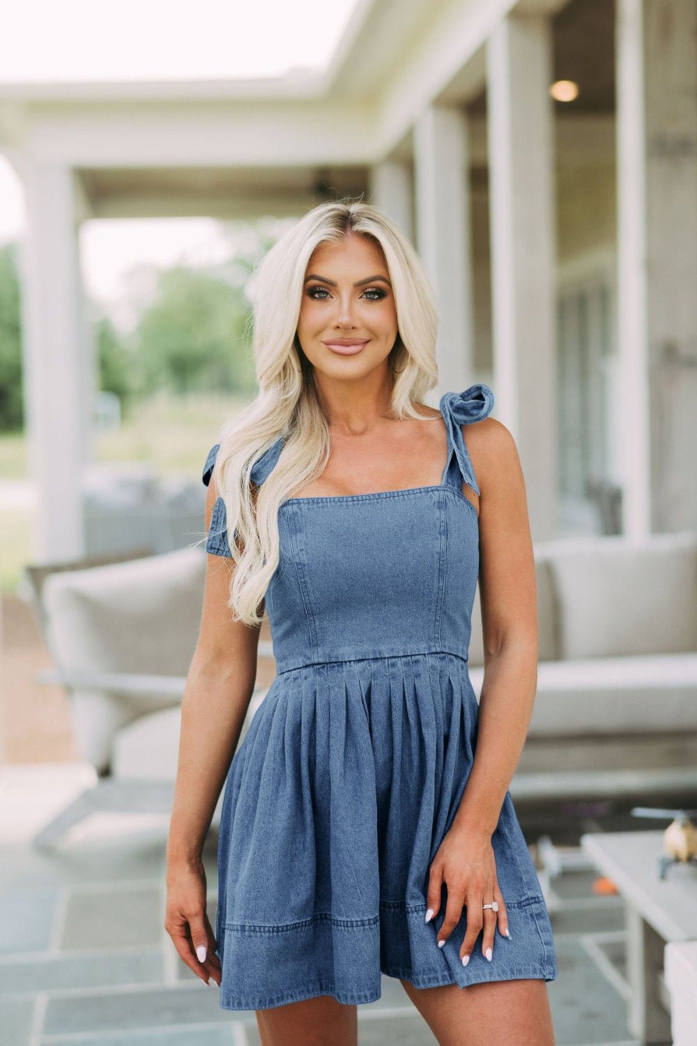 Denim fit-and-flare mini dress with tie straps and square neckline in dark blue.