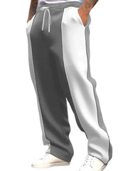 Panelled track pants in gray and white with drawstring waist and pockets.