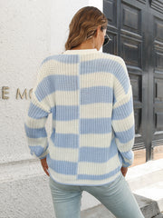 Misty Blue and white striped acrylic sweater with a checkerboard pattern detail.