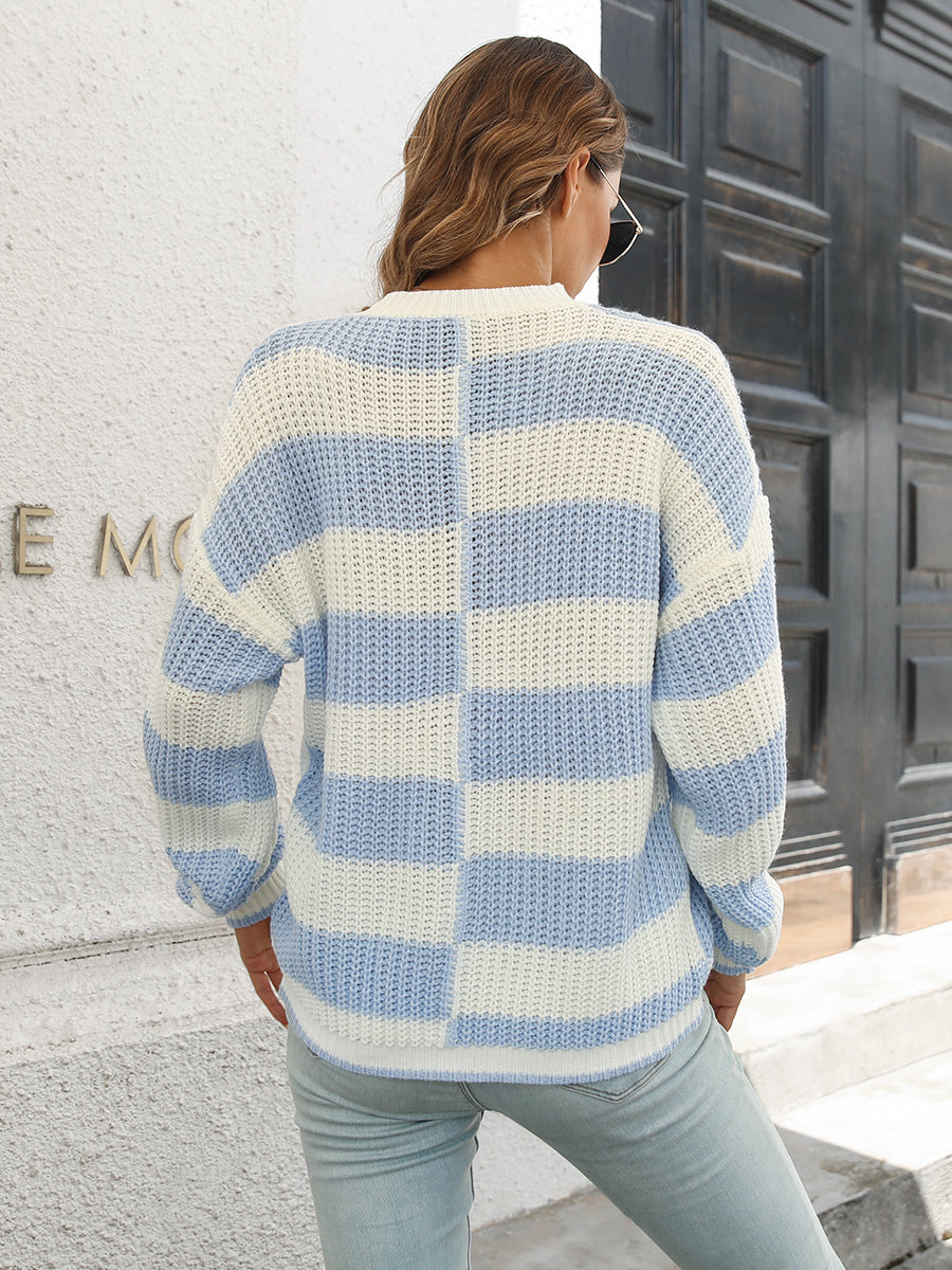 Misty Blue and white striped acrylic sweater with a checkerboard pattern detail.