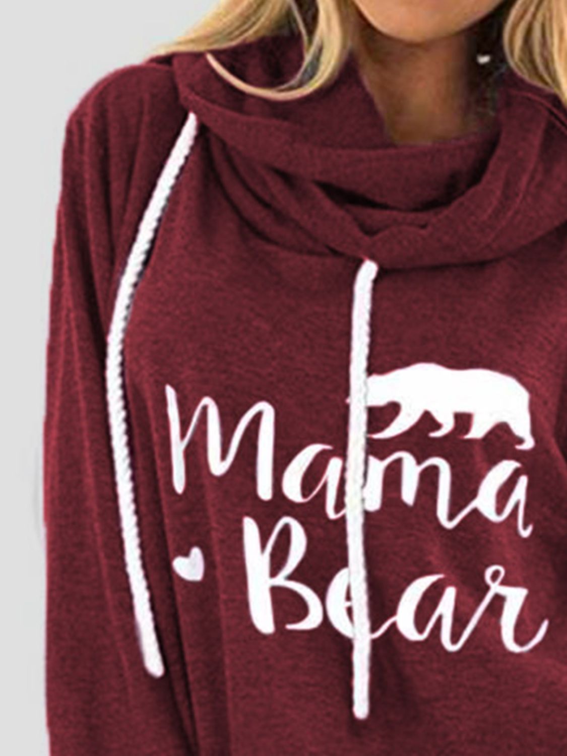 Burgundy cowl neck hoodie with white Mama Bear graphic and drawstring.
