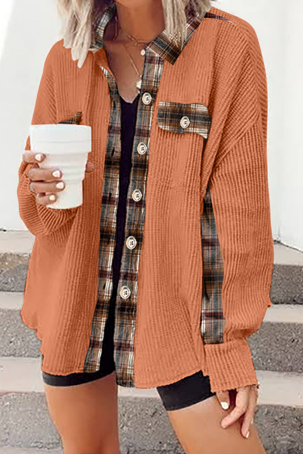 Tangerine waffle knit overshirt with plaid trim and buttons, worn open over a black tank top.