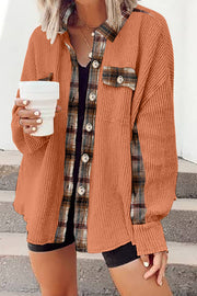 Tangerine waffle knit overshirt with plaid trim and buttons, worn open over a black tank top.