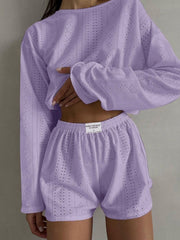Lavender perforated crop top and shorts set with long sleeves and elastic waistband.