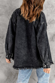 Oversized black denim shirt jacket with frayed hem and button cuffs.