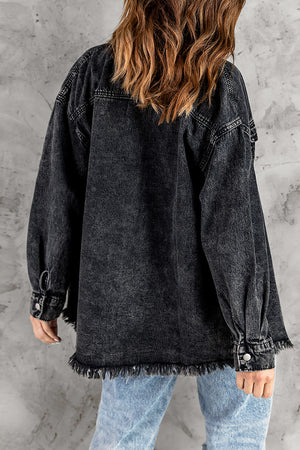 Oversized black denim shirt jacket with frayed hem and button cuffs.